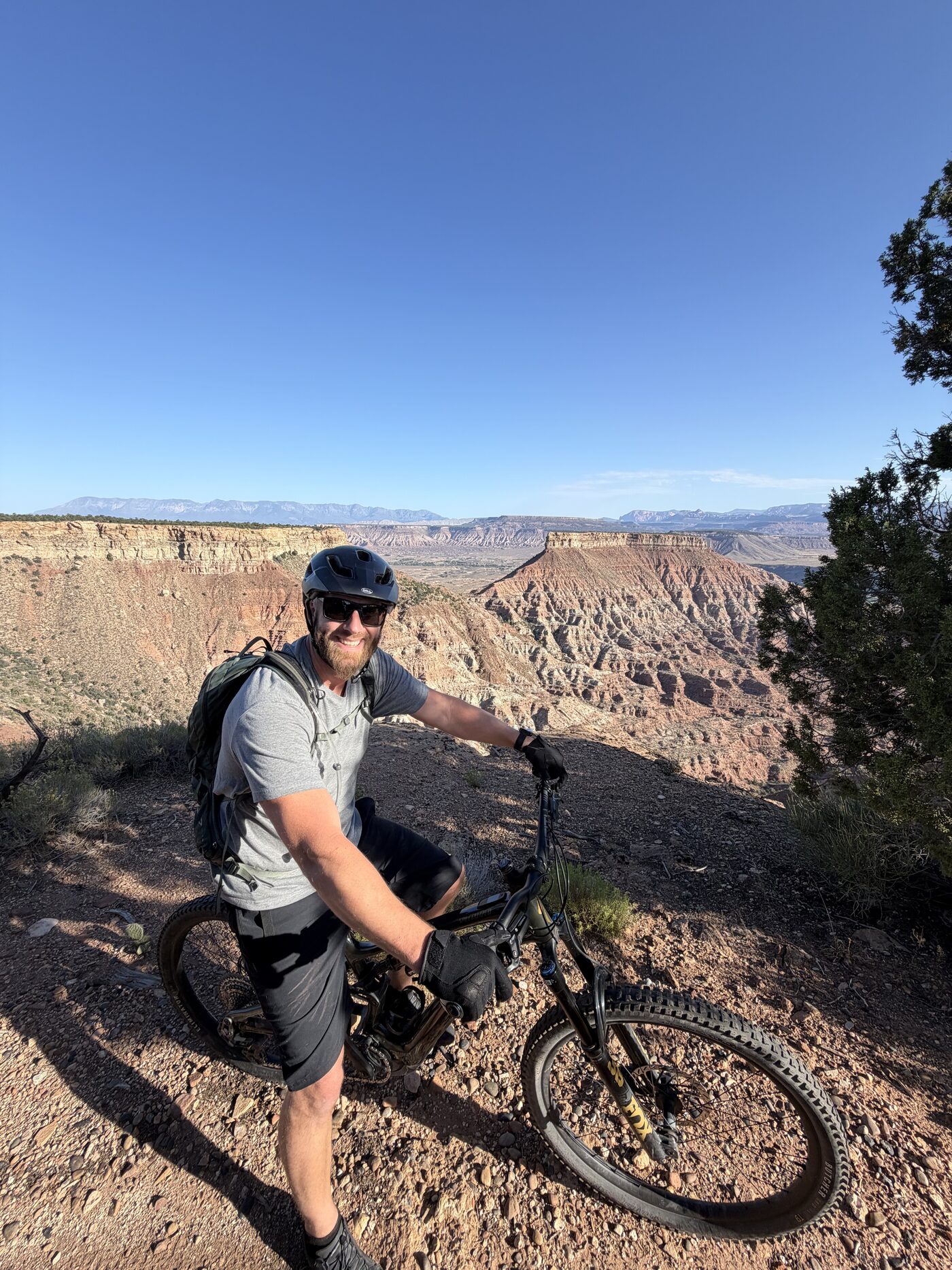 Blake on his mountain bike at a canyon rim in southern Utah